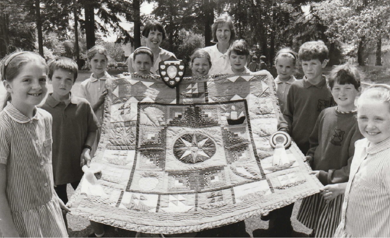 LEARNING: Pupils from Class 5 at Grange C of E School whose patchwork hanging won a prize in a national magazine competition in 1992. With them are supply teacher Dorothy Milner (rear right) and non-teaching assistant Dorothy Goslin